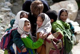 A small group of young Balti scholars laugh at the camera during recess in Turtuk, a small village in Ladakh. The literacy rate among this small population, including that of children is quite high - Photo By Storm Is Me