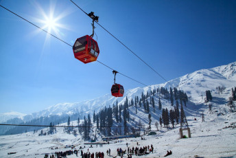 A high altitude gondola cable car transports visitors on two stages to and from the Kongdoori Mountain in Gulmarg, Jammu - Photo By ImagesofIndia