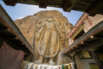 A striking, enormous image of the Maitreya or Future Buddha carved onto a slab of solid rock at Mulbekh Village near Leh, Ladakh. It overlooks the old trade route as well as the modern-day road, and dates from the eighth century - Photo By Mazur Travel