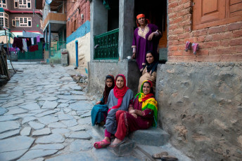 A Kashmiri family sits at the entrance to their home in the so-called Village of Shepherds, Pahalgam. This town is the starting point of the summer pilgrimage or yatra which draws 1000’s of devotees every year - Photo By Asada Nami