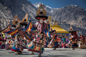 Tibetan Buddhist monks perform the lively ritual mask dance called cham during an annual religious festival at the Diskit Monastery, Nubra Valley. Cham dances are considered a form of meditation and offerings to the gods - Photo By Zoltan Szabo Photography