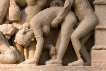 An intimate picture carved on the walls of an erotic temple in Khajuraho, Madhya Pradesh, India. The temple depicts the idea of life that engaged artful objects to create something inspirational © OlegD / Best of North and South India Tour