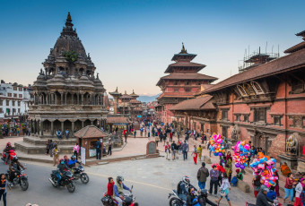 Durbar Square, a World Heritage Site in the center of Kathmandu, is the heart and soul of the city. Beautifully carved wooden shrines and temples are admired by crowds of visitors daily. © fotoVoyager