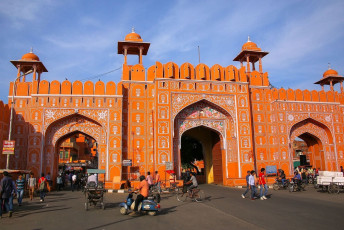 People walk and ride through the Ajmeri Gate in Jaipur, India. It is a typical looking Mughal Indo-Islamic gate and single arched © Don Mammoser