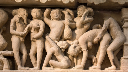A view of well known erotic sculptures of Khajuraho, which is a group of Hindu temples and Jain temples in the Chhatarpur district of Madhya Pradesh, India © OlegD