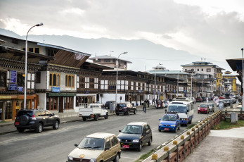 The valley town of Paro in Bhutan is a historic city with many traditional style buildings housing restaurants, offices and shops, especially in the main street. There are also numerous sacred dzongs and other places of interest to interest travelers © Lcchew