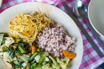 A typical Bhutanese dish is tasty and simple, consisting of rice and vegetables. Bhutan cultivates a large variety of vegetables and fruit, as well as rice © Wai Chung