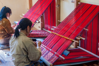 The weaving skills of women from east Bhutan are world famous and their products are highly sought after. Though traditional motifs and patterns are used, they often add their own creative ideas so no two textiles are 100% the same © UlyssePixel