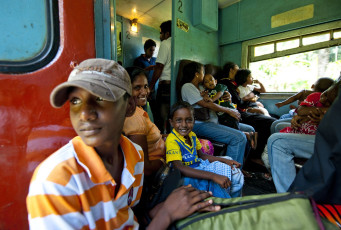 Smiling passengers enjoy their scenic train ride, Sri Lanka © Tarzan9280