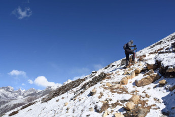A trekker ascends Nangkartshang Peak in the Khumbu region. The peak is a popular site with spectacular panoramic views of many surrounding peaks © Alexander Jung