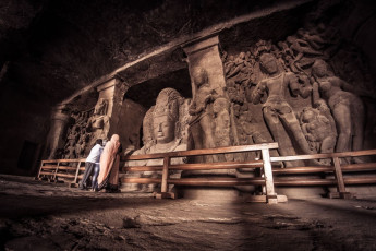 Thousand-year-old statues of Shiva in various forms can be viewed at the UENSCO Elephanta Caves on Elephanta Island, which is just a 1 hour ferry ride from Mumbai. ©  Daniel Doerfler/ Shutterstock