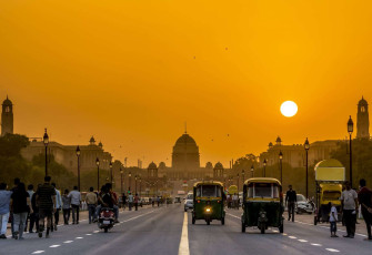A golden sunset scene in New Delhi with the Rashtrapati Bhavan, official residence of the president of India in New Delhi. The building also includes reception halls, guest rooms and offices © Kriangkrai Thitimakorn