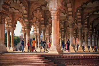 A picture outlining the mughal art, the majestic Agra Fort, wherein a cluster of India tourists are gathered, wandering around and embracing its beauty, Agra, India. © t-lorien