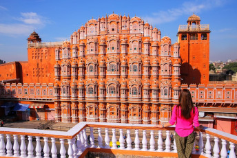 The impressive Hawa Mahal, built in 1799 in red and pink sandstone, is also called the Palace of the Winds. The design is reminiscent of the Hindu deity Krishna’s crown and the elaborate lattice work allowed the royal ladies to watch the goings on in the street below without revealing themselves, Jaipur, India © Don Mammoser