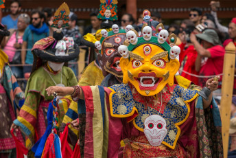Dressed in colorful costumes, monks perform Tibetan Buddhist mask dances during the Hemis Festival, Ladakh © Mazur Travel