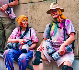 These visitors protect their cameras with plastic covers so they are not damaged by the powder thrown during the Holi festival. © MindStorm  / Shutterstock