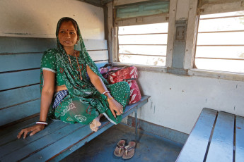 A woman rests aboard the train that runs between Phulad and Kamlighat in Deogarh. The bridges and tunnels its track passes are the same depicted in Rudyard Kipling's The Man Who Would Be King.  © Pierre Jean Durieu