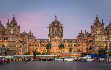 The historic Chhatrapati Shivaji railway terminus in Mumbai is painted in a golden hue by the rays of the setting sun. Built in Italian Gothic style, it is a UNESCO Word Heritage Site and one of the busiest railway stations in India