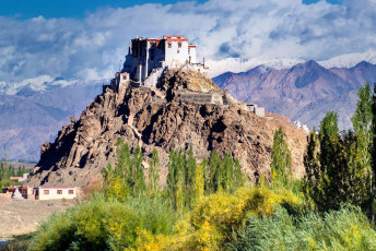 A mesmerizing view of the Stakna Monastery located on a small Hill top with a glimpse of the Himalayan Mountains at the backdrop. The shape of the hill is like the nose of a tiger and hence the name of place in Leh, Jammu and Kashmir, India © Rudra Narayan Mitra