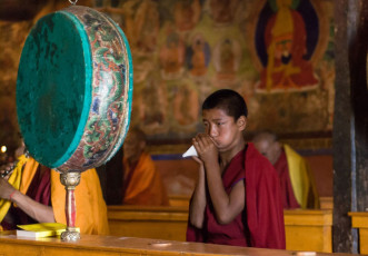 A young Buddhist monk plays on a shell during a Buddha ceremony at Thiksey Monastery, Ladakh, India. It is a Tibetan Buddhist monastery with an active monk community, including quite young boys © Pavel Dobrovsky