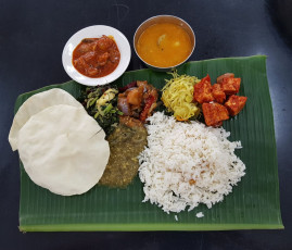 Chettinadu vegetarian and non-vegetarian meals on Banana leaf © sky