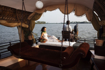 A private houseboat will take you through the serene backwaters of Kerala. You will spend the night in an airconditioned bedroom on your houseboat © OSTILL is Franck Camhi