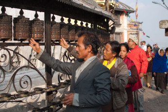 Visitors and devotees at the Swayambhunath Temple circling the stupa which is dome-shaped and famously known as the monkey temple. It receives pilgrims and tourists from every nook and corner of the world, Nepal © Mohd Shukur Jahar