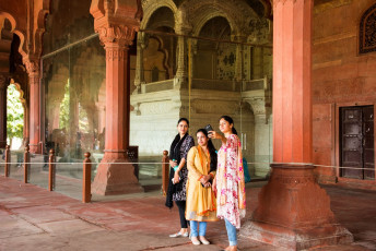 Visitors take a selfie at the historic Red Fort, former royal residence of the Mughal emperors in India until 1857 and a World Heritage Site. In the background is the famous Peacock Throne - Photo By  CRS PHOTO