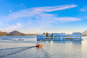 The Taj Lake Palace seems to float on Lake Pichola in Udaipur. It was the summer retreat of the Mewar royal family in the 1700’s and is now a luxury hotel - Photo By  photoff