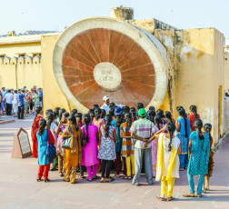 Visitors exploring the Jantar Mantar Observatory. It is a collection of nineteen architectural astronomical instruments and features the world's largest stone sundial. It is a UNESCO World Heritage site situated in Jaipur, Rajasthan, India. © Jorg Hackemann