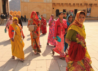 Local women arriving at the Amber Fort to witness a folk performance. © OzPhotoGuy