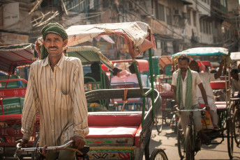 Rickshaw pullers look for passengers in the scorching heat in the streets of Old Delhi. © Elena Ermakova