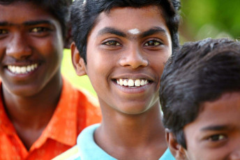 A group of Indian boys smiling for the camera. © VS Anandhakrishna