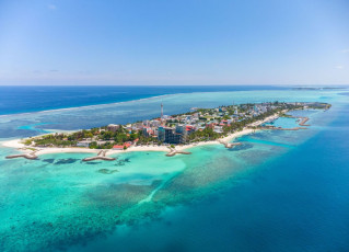 Maafushi Island, here seen from the air, is one of the largest and prettiest of the inhabited islands of the Maldives © Paiboon Chooklin