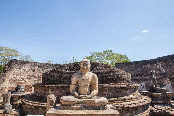 One of the four Buddha statues, carved from solid rock in Vatadage in ancient Polonnaruwa. Each statue faces another directions and of the four two have survived almost intact © calvste