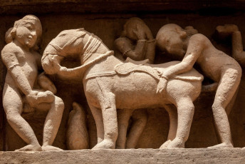 The famous erotic stone sculptures at the Lakshmana temple, Khajuraho. The temple is dedicated to the four head form of Lord Vishnu, Vaikuntha Chaturmurti, Khajuraho, India. © f9photos