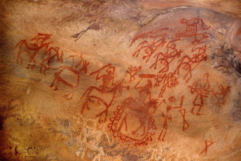 Tribal paintings on the cave walls of rock shelters are a proof of the artistic talent of the primitive cave dwellers of Bhimbetka near Bhopal in Madhya Pradesh. It exhibits the earliest traces of human life on the Indian subcontinent and evidence of Stone Age India, Asia. ©Mahantesh C Morabad