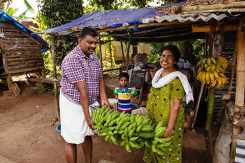 A nuclear family selling green bananas at the local bazaar in Kochi (Cochin), Kerala. © Dmytro Gilitukha