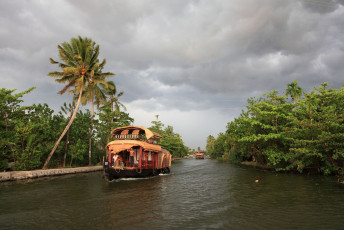 A mesmerising houseboat trip at the backwaters in Alleppey. Surrounded by greenery and calm water, a houseboat trip in Alleppey is indeed one amazing experience. © AJP