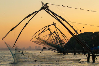 A scenic view of a lane of Chinese fishing net at the time of sunrise in Cochin (Fort Kochi), Kerala, India. © Alexander Mazurkevich