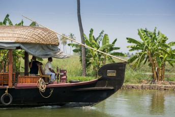 Scenic beauties of the backwaters of Kerala with an addition of amazing Houseboat trips located in Kerala, India. © sergemi