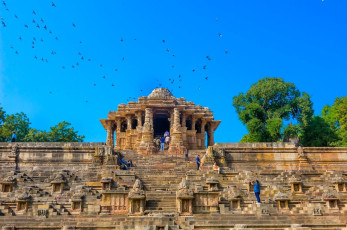Visitors admire and click pictures of the Sun Temple at Modhera near Mehsana, which is dedicated to the Hindu deity Surya that represents the sun. © Sharad Raval