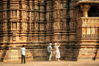 Intricately carved erotic sculptures cover the entire wall of one of the temples of the famous ancient Khajurahu Group in Madhya Pradesh / Tiger Safari Tour India