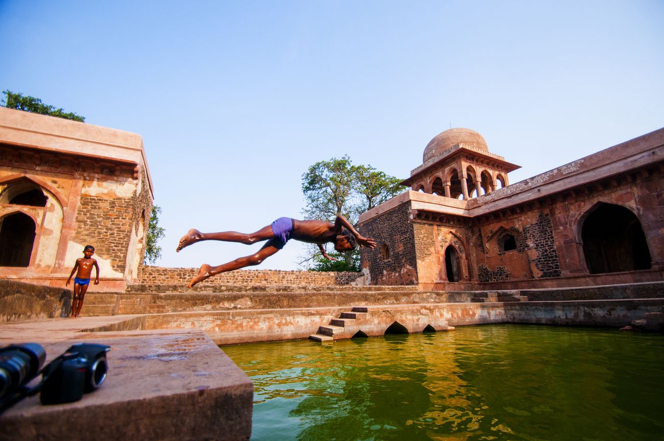 At Baz Bahadur Palace in Mandu a young boy takes a swim