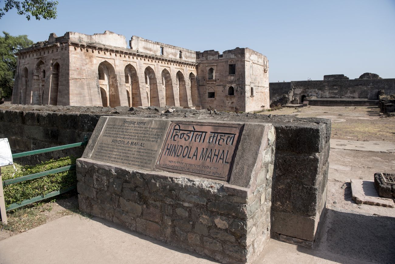 The slanting walls of the Hindola Mahal are clearly visible from the south eastern corner. The Swinging Palace or Hindola Mahal was built by Hoshang Shah in 1425 C.E. It is believed to have been a meeting hall situated in Mandu, the old Indian city, Madhya Pradesh