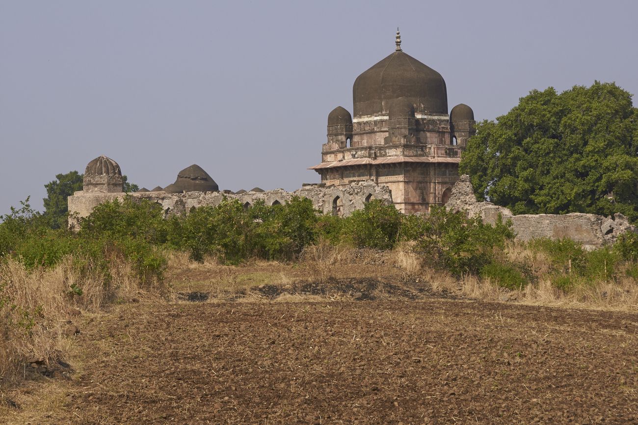 Mausoleum of Darya Khan in Mandu’s fortress on the hill. This 16th century AD structure has a centre dome, as well as a smaller one on every corner in an encircled complex