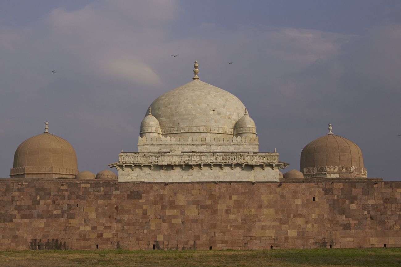 Hoshang Shah’s ancient, Islamic tomb sits on Mandu’s hilltop fort. This white marble building was constructed in the 15th Century AD