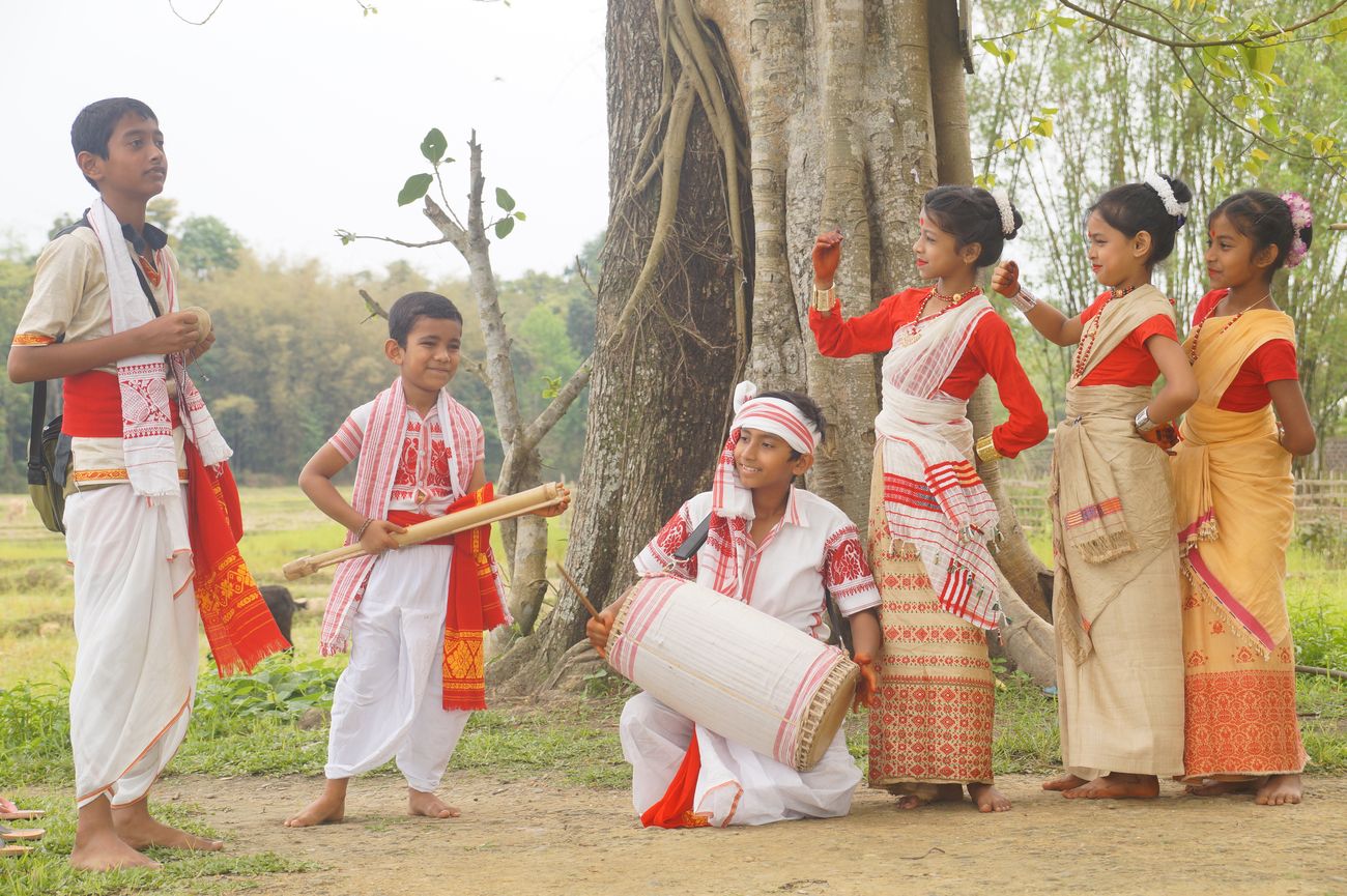 Little boys and girls wear traditional folk dresses as they prepare for the folk Bihu dance in Jorhat, Assam