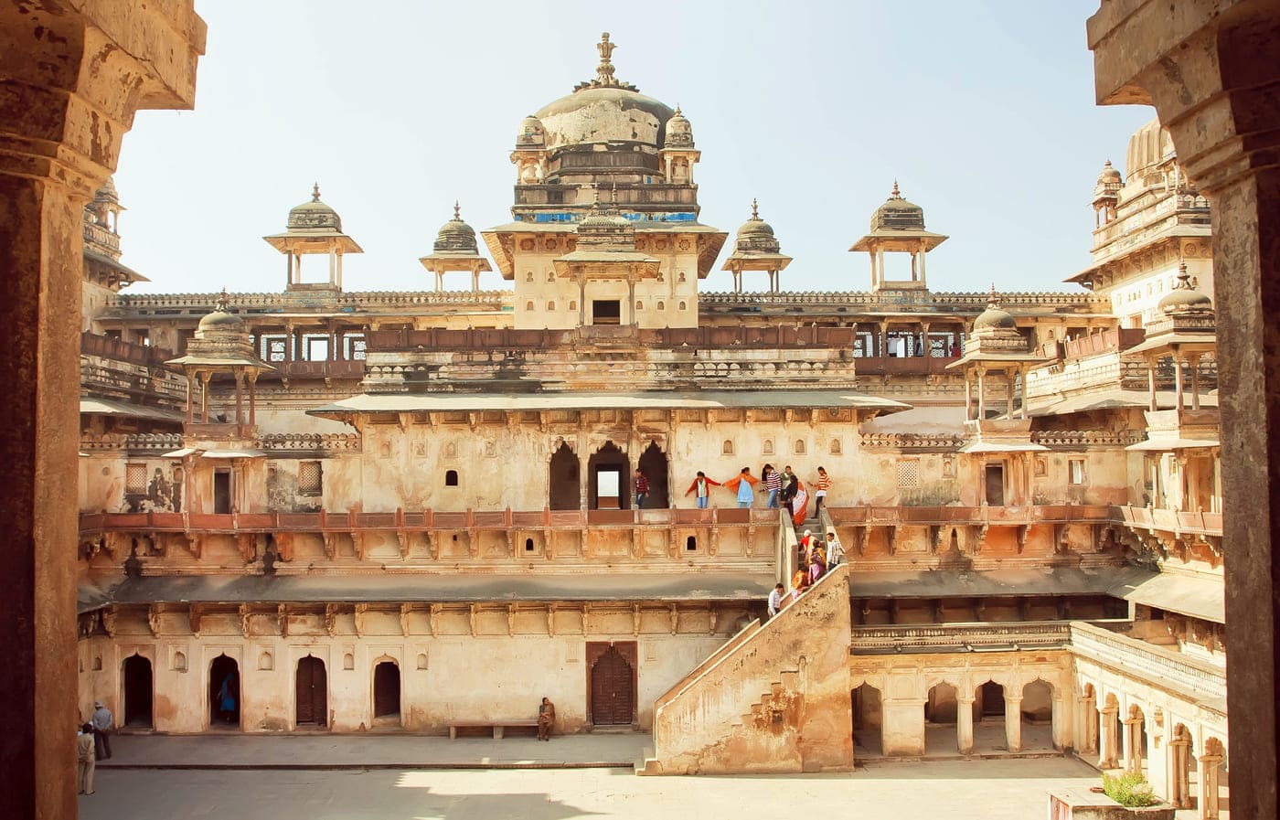A group of visitors climb up the stairs at ancient fort Jahangir to explore the environs and interiors of the seventeenth century mammoth structure, Orchha 