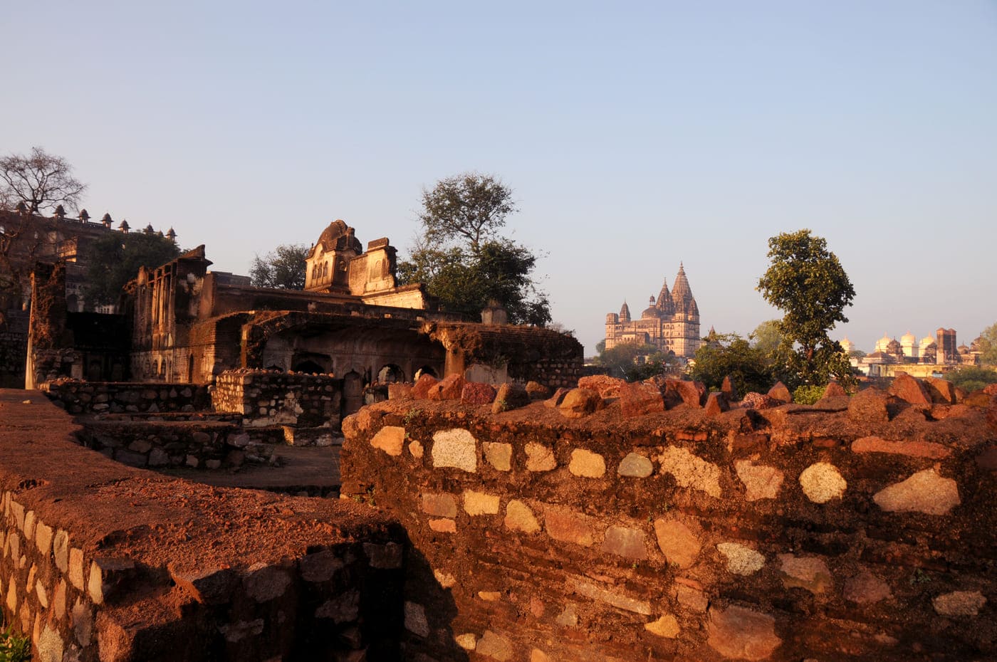 A scenic view of spires of the historic Chaturbhuj Temple, situated in Orchha, during twilight 